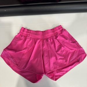 Lululemon hotty hot shorts in sonic pink. Size 4 with 4 inch length.